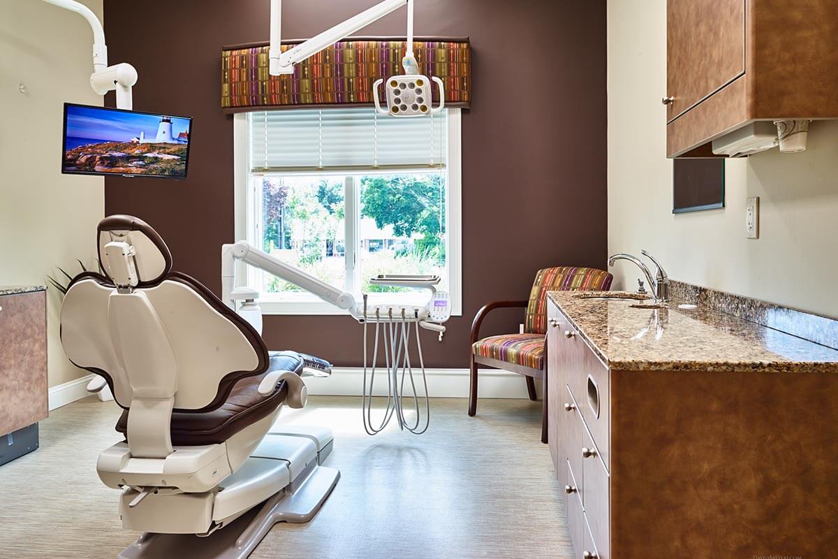 dental exam room with brown wall and large window