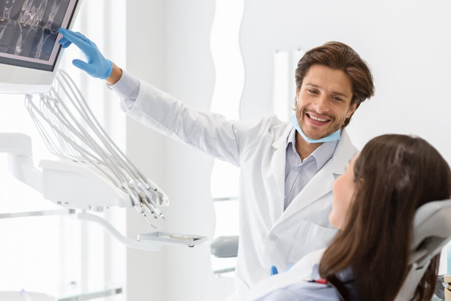 dentist showing dental exams